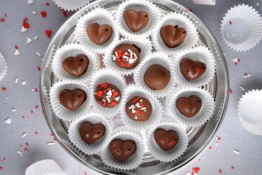 Fitness chocolate truffles or pralines with banana cashew filling