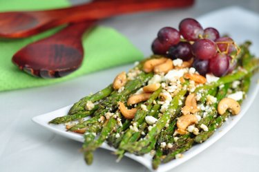 Roasted Asparagus on Garlic with Feta and Cashew Nuts
