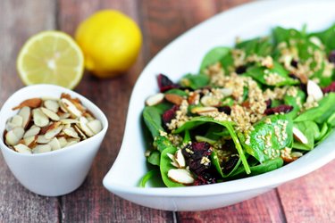 Spinach salad with mustard-honey-sesame seed dressing