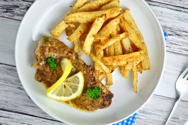 Braised cod in lemon-garlic sauce with celery fries