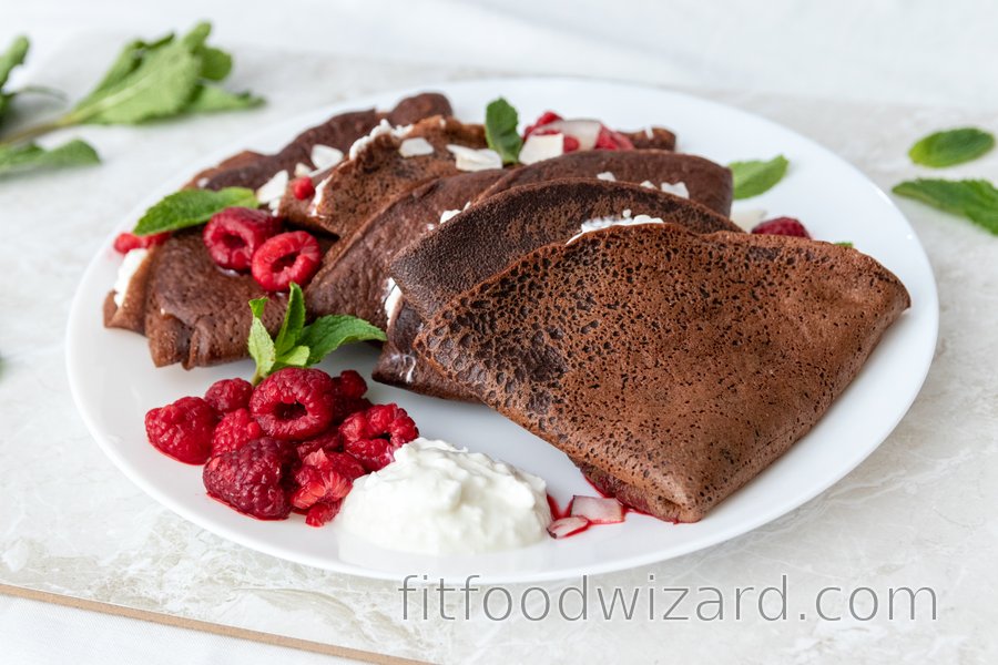 Spelt chocolate crepes with ricotta and hot raspberries