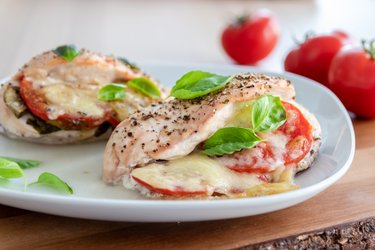 Roasted chicken breasts "Caprese" with tomatoes, basil, and mozzarella