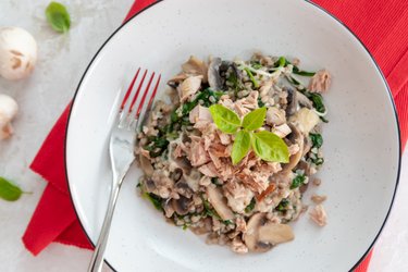 Healthy buckwheat with spinach, mushrooms, cheese, and tuna